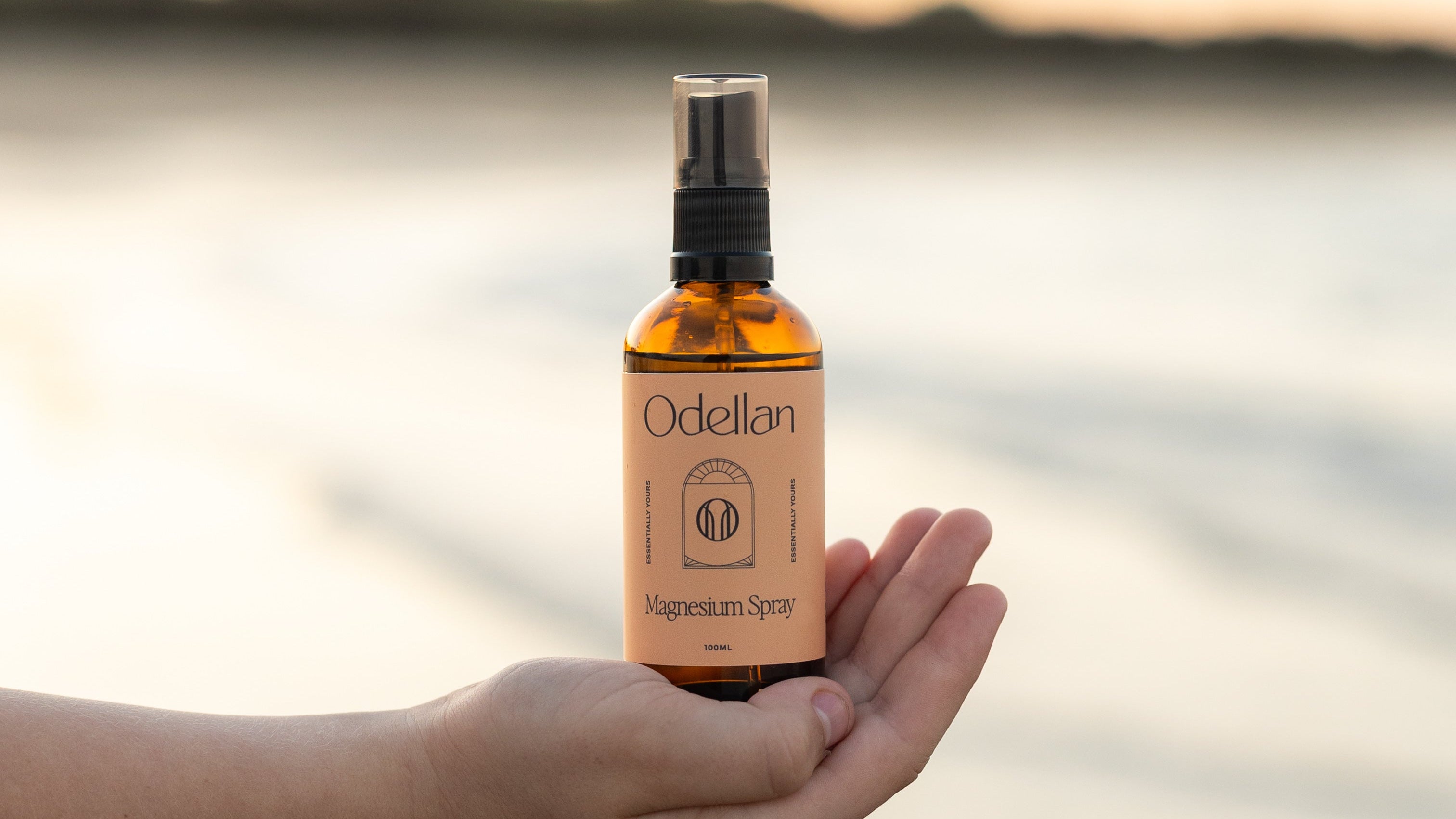Odellan's 100mL Magnesium Oil Spray - sitting on a hand