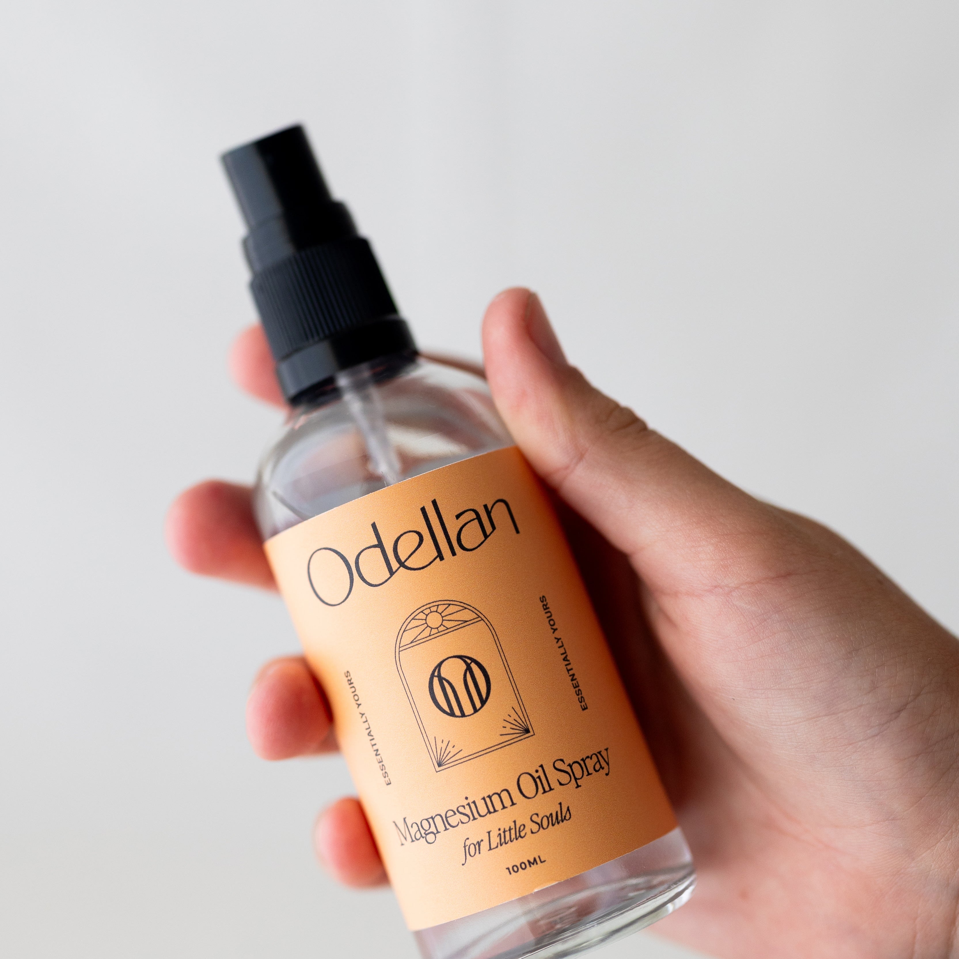 Child applying magnesium spray at bedtime